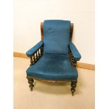 A late Victorian mahogany framed elbow chair upholstered in blue material