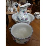 A late Victorian floral decorated toilet jug with bowl and chamber pot