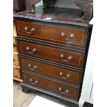 A reproduction mahogany chest of drawers style lift top music cabinet