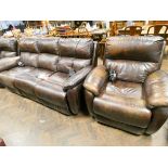 An electrically operated reclining three piece lounge suite in chocolate brown leather