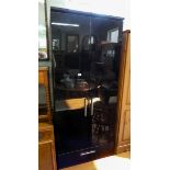 A modern black lacquered finished two door wardrobe with two drawers under 2'6 wide