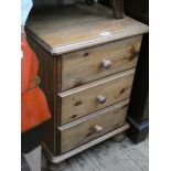 A modern pine bedside chest fitted three drawers