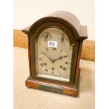 An early 20th Century mahogany cased bracket clock with chiming and striking movement and dome