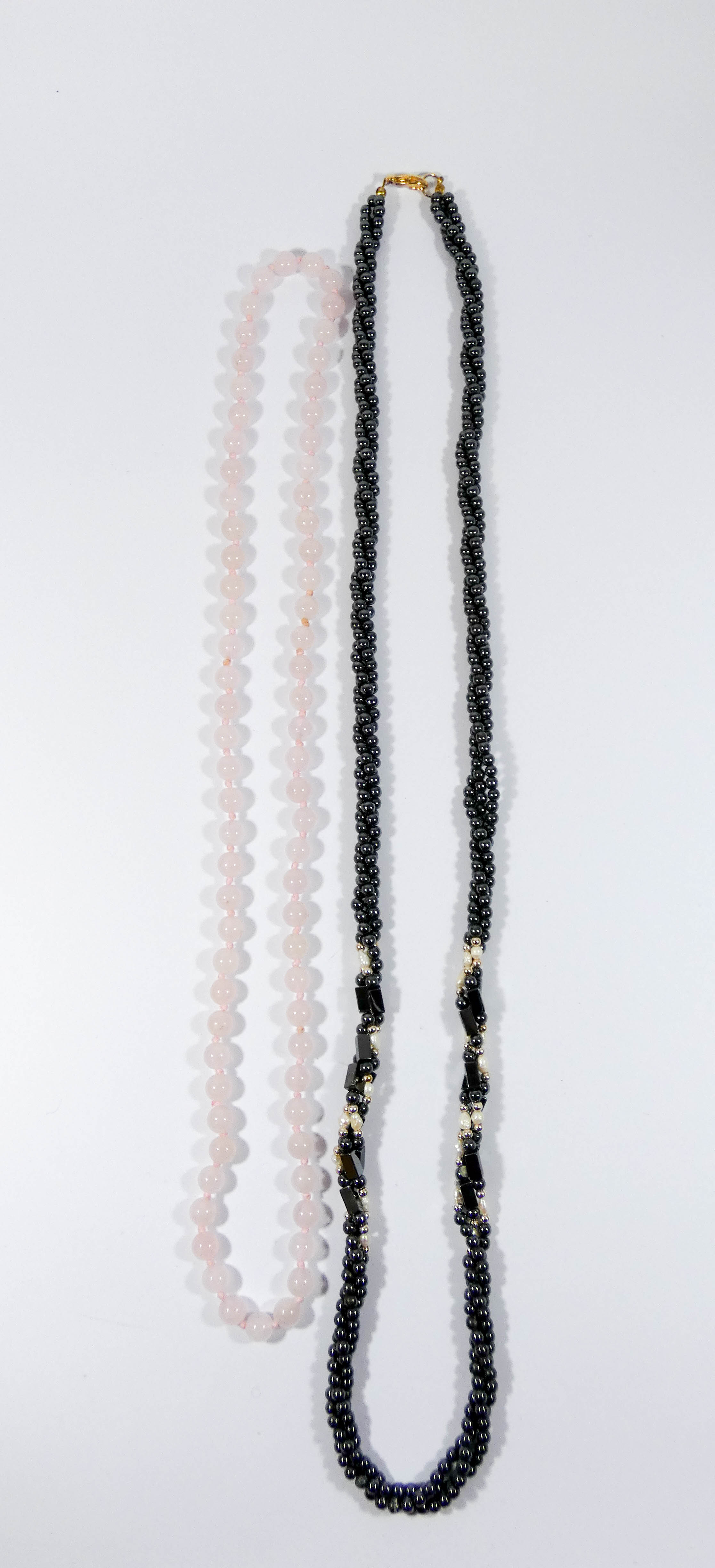 Row of rose quartz beads and a row of hematite and freshwater pearl beads