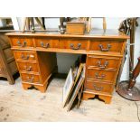 A reproduction yew wood twin pedestal desk fitted nine drawers with green leather top 4' wide
