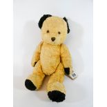 An old much loved joined golden mohair Teddy bear with glass eyes,