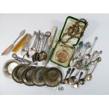 A collection of plated items and foreign white metal items to include fruit knives, small dishes,