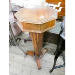 A late Victorian walnut octagonal work table on pillar base