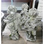 Three reconstituted stone cherub musicians each approx 23" tall