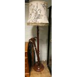 A mahogany reeded column standard lamp with floral shade