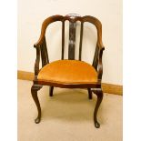 Edwardian mahogany tub shaped elbow chair with gold upholstered seat standing on cabriole style