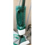 A Vorwerk upright vacuum cleaner with accessories