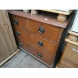 A late Victorian stained pine chest of two long and two short drawers