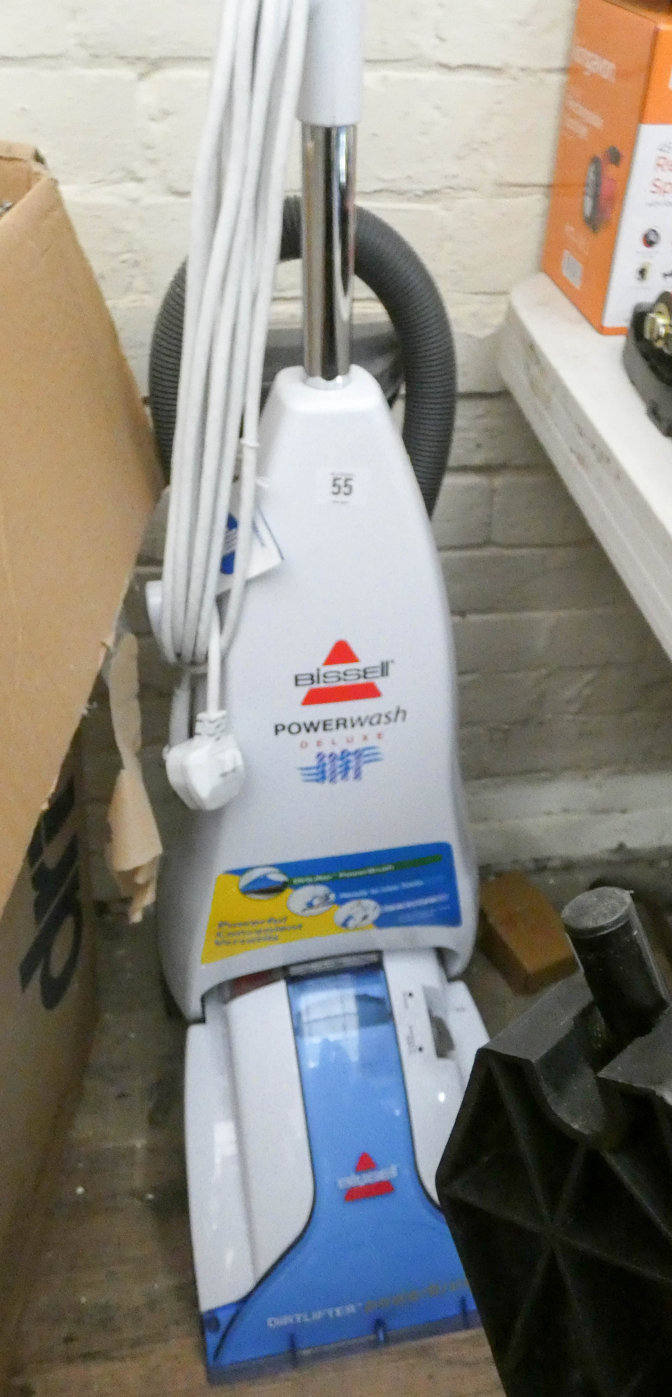 A Bissell power wash deluxe carpet cleaner