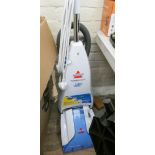 A Bissell power wash deluxe carpet cleaner