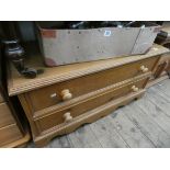 A low pine chest of two long drawers with bun handles 3' wide