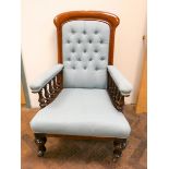 A late Victorian mahogany framed elbow chair in pale blue upholstery with buttoned back and padded