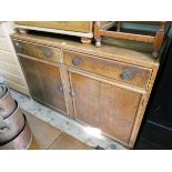 A 1950's oak sideboard fitted drawers and cupboards 4' wide