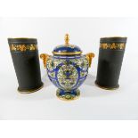 A Royal Worcester twin handled vase and cover together with a pair of Wedgwood black Basalt taper