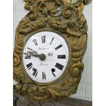 Two old French brass embossed wall clocks with striking movements and enamel faces (both have no