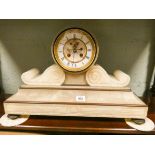 A French striking mantel clock in a white alabaster case 13 1/2" high,