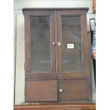 A small stained glazed spice cabinet