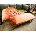 An Edwardian satin walnut framed pink dralon upholstered chaise longue