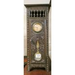 A French clock in a carved miniature oak wardrobe style case