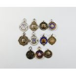 A collection of silver and enamelled sporting and other medallions, eleven in the lot,