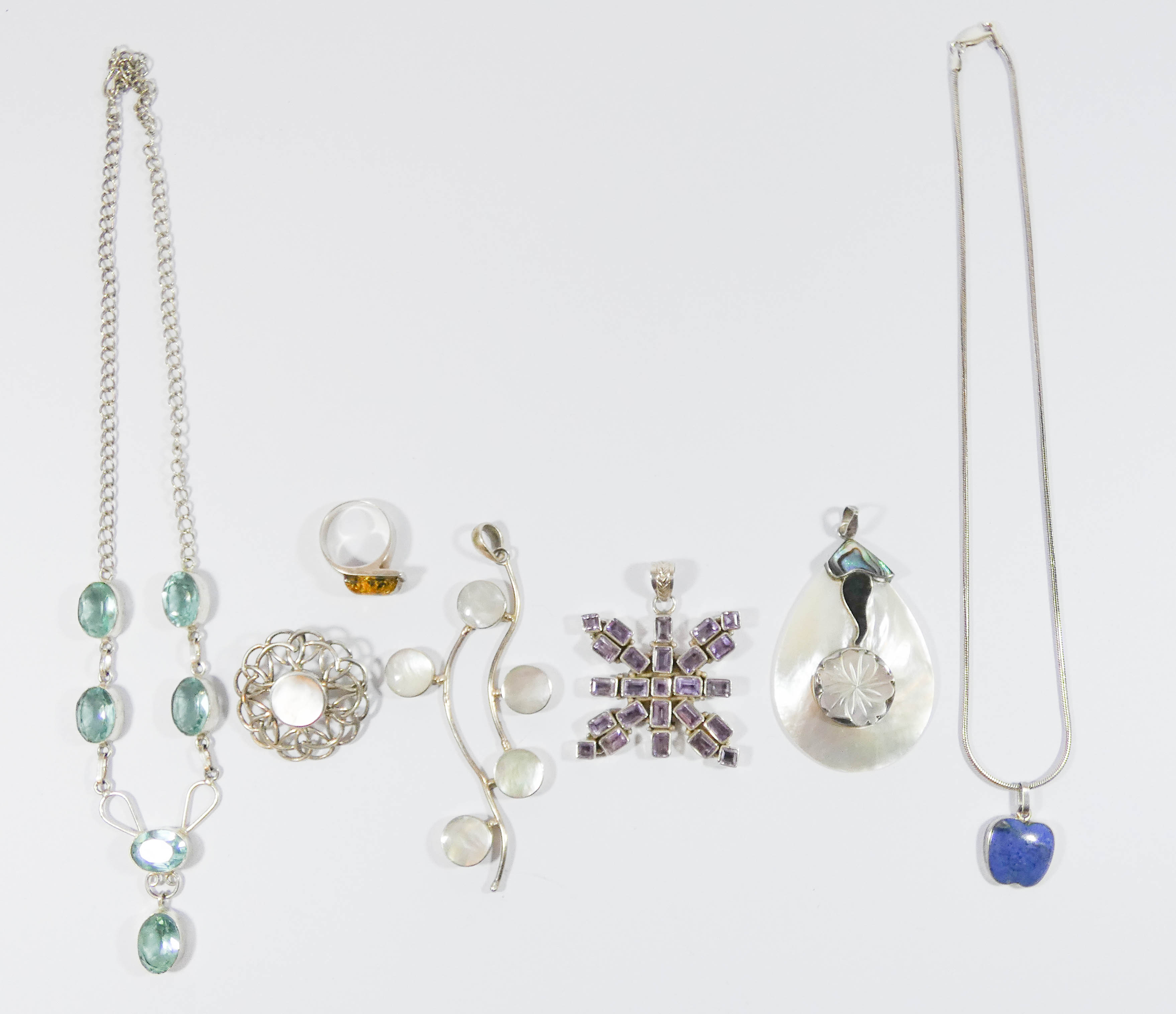 A collection of silver jewellery - mother of pearl set pendants,