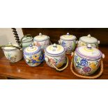 Eight various Poole Pottery biscuit barrels
