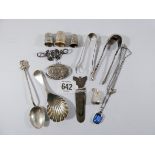 A collection of small silver items to include shell shaped caddy spoon, thimbles, book mark, locket,