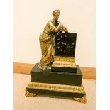 A 19th century French striking mantel clock in black marble case with gilt lady bronze figure mount