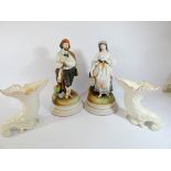 A pair of continental porcelain coloured bisque figurines and a pair of Belleek porcelain