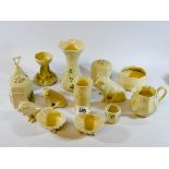 Another collection of Belleek china, fourteen pieces in all, to include pigs, a bell, vases,