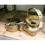 Three graduated in size brass saucepans,