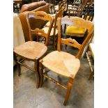A set of six French oak framed dining room chairs standing on cabriole style front legs with rush
