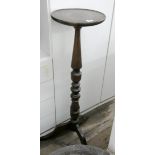 A mahogany turned column Torchiere on tripod base and an ebonised column Torchiere