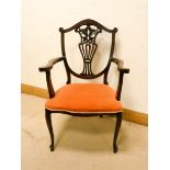 Edwardian mahogany elbow chair on cabriole legs with terracotta upholstered seat