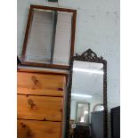 A long wall mirror in gilt frame and an oak framed bevelled mirror