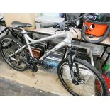 A silver and black giant boulder gents bicycle with front suspension