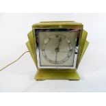 An Art Deco green onyx mantel clock with electrical work dial signed Penlington,