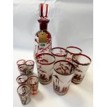 A set of Bohemian red and frosted glass decanter set depicting figures in a Chinese landscape