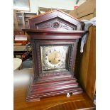 A large Edwardian bracket clock with striking movement with brass and silver dial in a mahogany