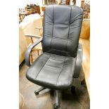 An Executives revolving black office elbow chair
