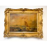A Victorian oil painting of a sailing boat in rough seas in a decorative gilt frame,