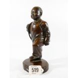 An early 20th Century carved hardwood figure of a marching child Mao period with glass eyes,
