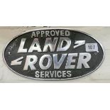 An approved services Land Rover wall hanging cast iron sign