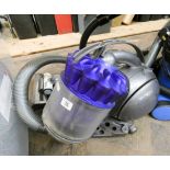 A mauve and silver Dyson ball style cylinder vacuum cleaner