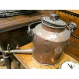 A large Victorian copper kettle fitted spout and brass tap with an iron handle